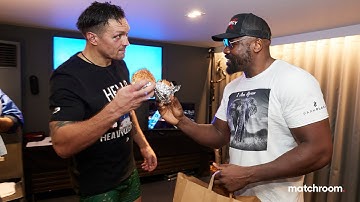 Oleksandr Usyk & Derek Chisora embrace over a burger backstage