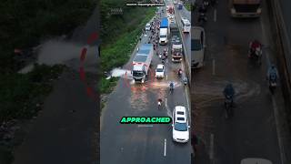 Truck Driver Blocks Water Burst to Help Traffic