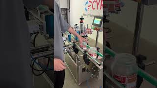 Labeling machine for transparent bottles