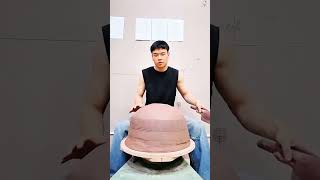 Hands mold clay mound steady, crisp rhythm of morning pottery shaping craft