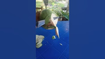 Fresh coconut water cutting skill using small knife,, while standing #short#fruit...