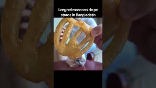 Lenghel mananca oe strada in Bangladesh