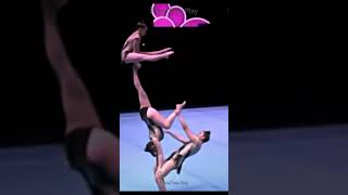 Perfect balance and teamwork at international gymnastics championships #Balance #Athletic #Shorts