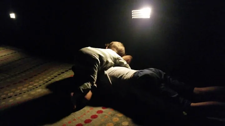 Funny video of ten month old wrestling with his five year old brother in a movie theater.