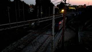 An intermodal freight train hauled by a Mercitalia Rail E652 passes through Milan Forlanini late in