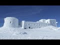 WORLDS BIGGEST SNOW FORT! 24 Hour Challenge In An IGLOO