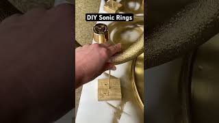 Make these DIY Sonic Rings with foam wreaths, spray paint, a 2x4 and a wooden dowel. #sonicparty