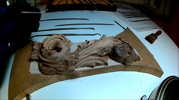 using Rifler files on a wood carving