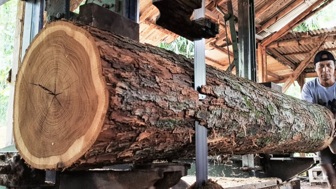 Beautiful fibers behind solid teak wood that is split into planks 