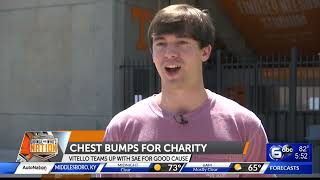 Tennessee head baseball coach Tony Vitello helps UT frat with chest bumps