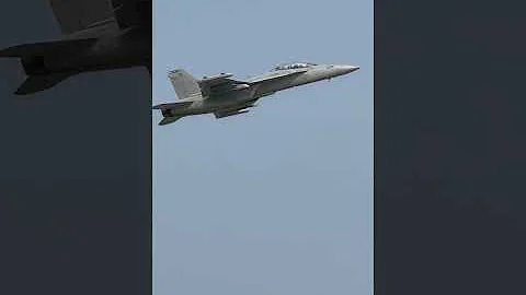 F18 makes a low pass and pulls up to a vertical climb at Oshkosh 2021