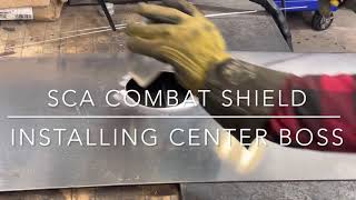 Welding a center boss on a SCA shield