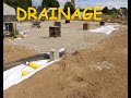 Pose drain  drainage terrain  maison  protection des fondations  autoconstruction famille jela