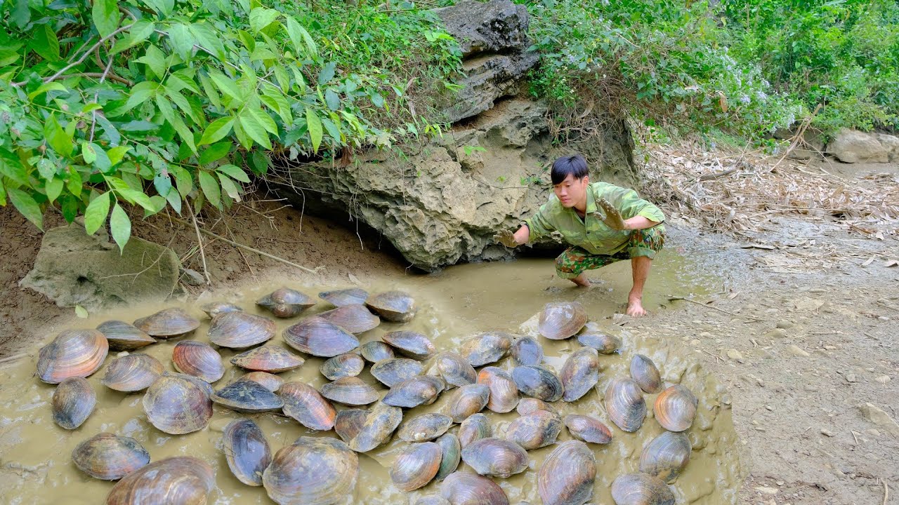 Catching mussels stranded in the stream bed and processing them in the
