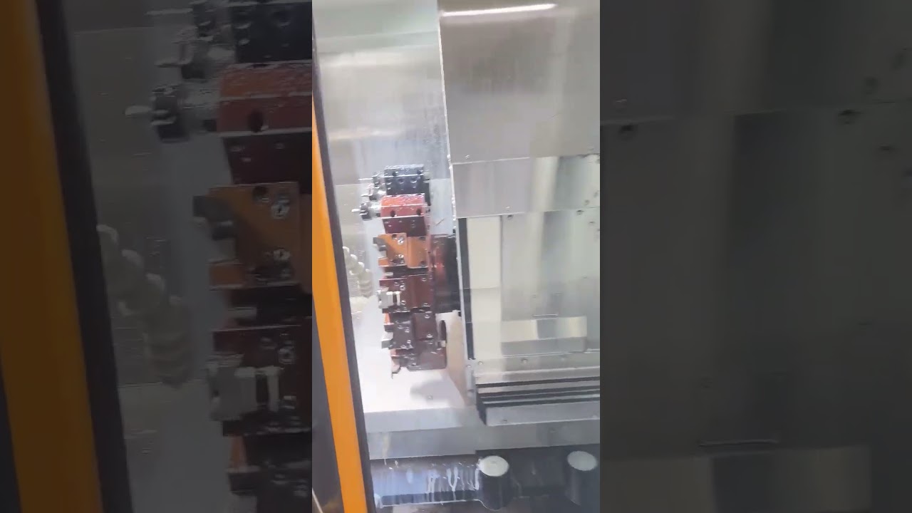 Precision in progress! The engineer fine-tuning and testing the CNC machining machine.  