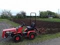 Ploughing with a mini tractor MTZ 132H