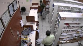 Surveillance footage of Jersey City pharmacy robbery on 9/30/15