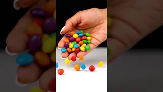 Pouring lot's of colourful rainbow candy sweet ASMR 