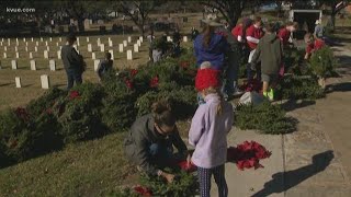 Volunteers clean up wreaths at Texas State Cemetery