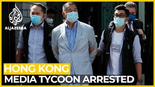 Hong Kong media tycoon arrested, newspaper raided