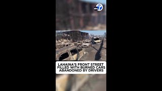 Lahaina's Front Street filled with burned cars abandoned by drivers who ran for their lives