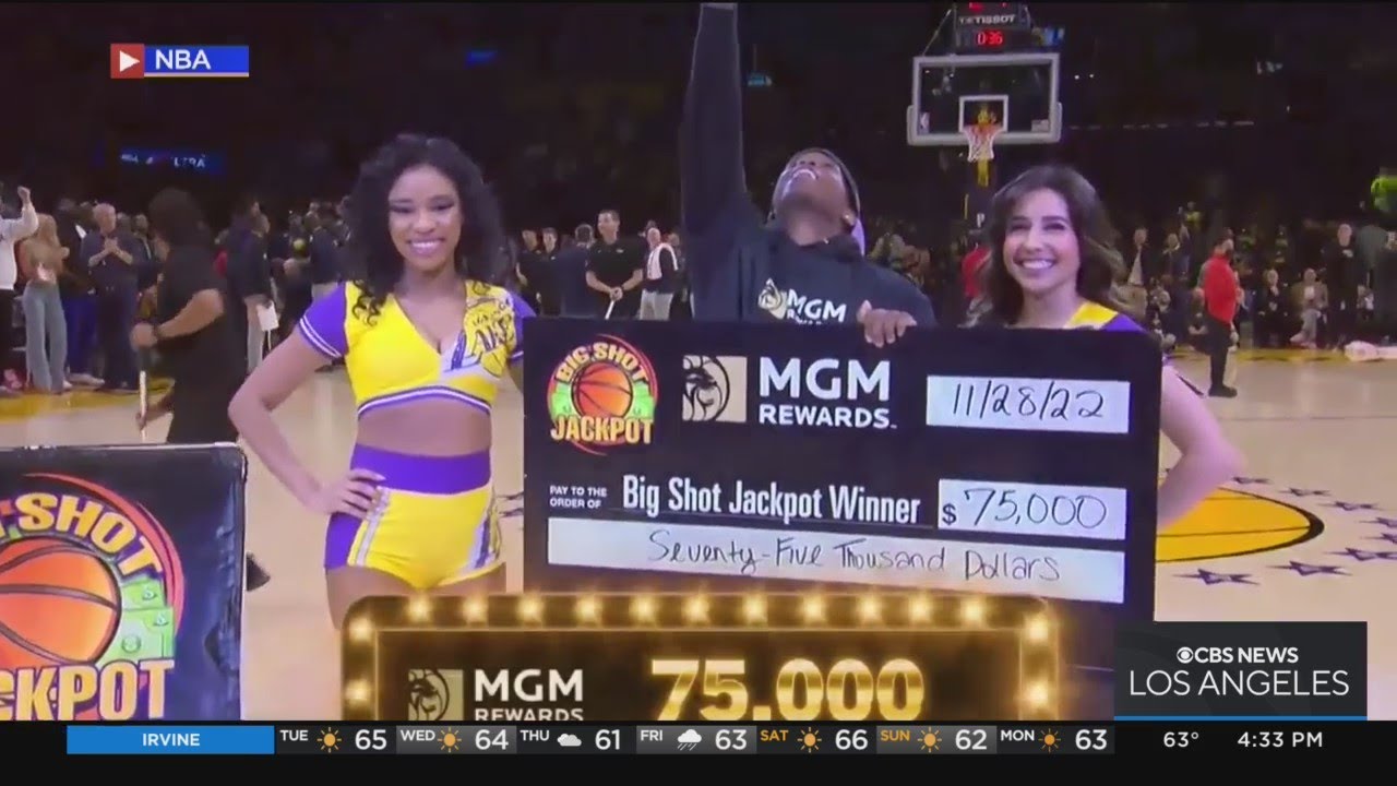 Lucky Lakers fan sinks half-court shot to win $75000