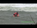 See how a small inflatable crosses a big set of waves at a river bar