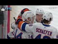 Mathew Barzal scores a goal against the New Jersey Devils