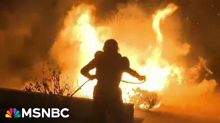 Thousands evacuated as strong winds fuel at least three blazes in LA area