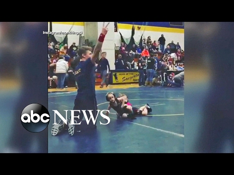 Boy runs from girl in toddler wrestling match