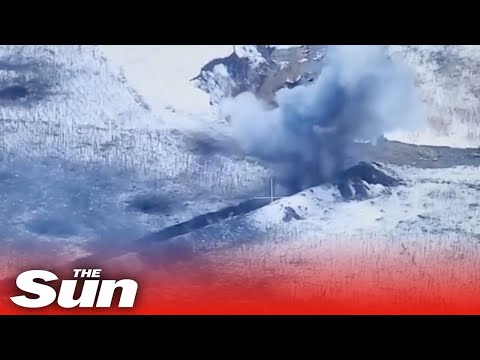 Ukrainian mortars blow up Russian troops hidden in snowy trenches.