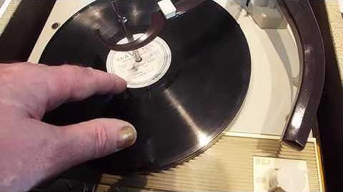 Voice of Music TUBE AMPLIFIED portable record player playing a 78 RPM record.