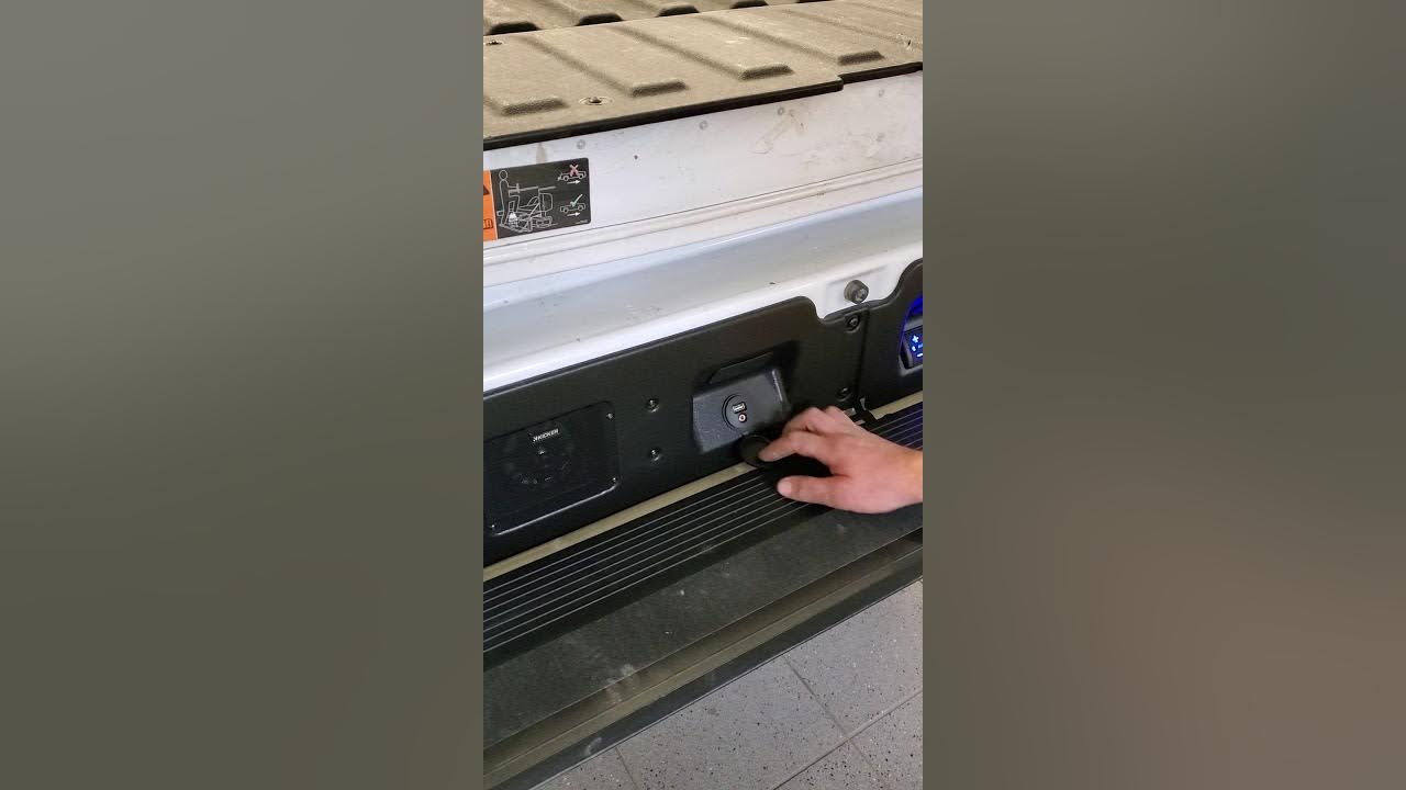 Installation of a kicker sound system in the tailgate of a GMC Sierra