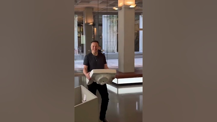 Elon Musk turns up at Twitter HQ carrying a sink