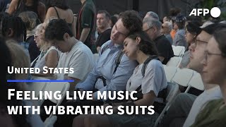 New York concertgoers feel live music through vibrating suits | AFP