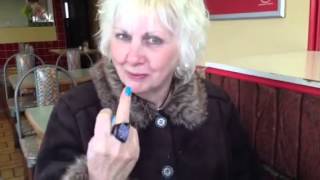 Mother Eating A Hamburger With A Knife And Fork