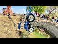 New holland 3630  4x4 tractor jumped in well with 2mb reversible plough rescue by hydra