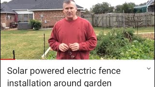Solar powered electric fence installation around garden
