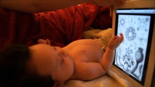 Newborn with an iPad