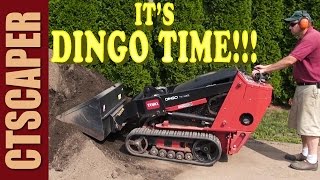 TORO DINGO SPREADING TOPSOIL AND GRADING BEDS