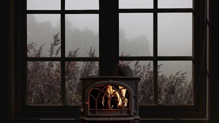 Rain on window - crackling fire and misty atmosphe...
