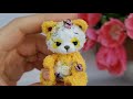 Mini crocheted yellow teddy panda bear. Custom miniature by Microtoysby