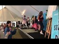 Zanni louise and kids doing stardust dance at byron writers festival