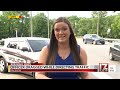 Raleigh police officer drug by car while directing traffic