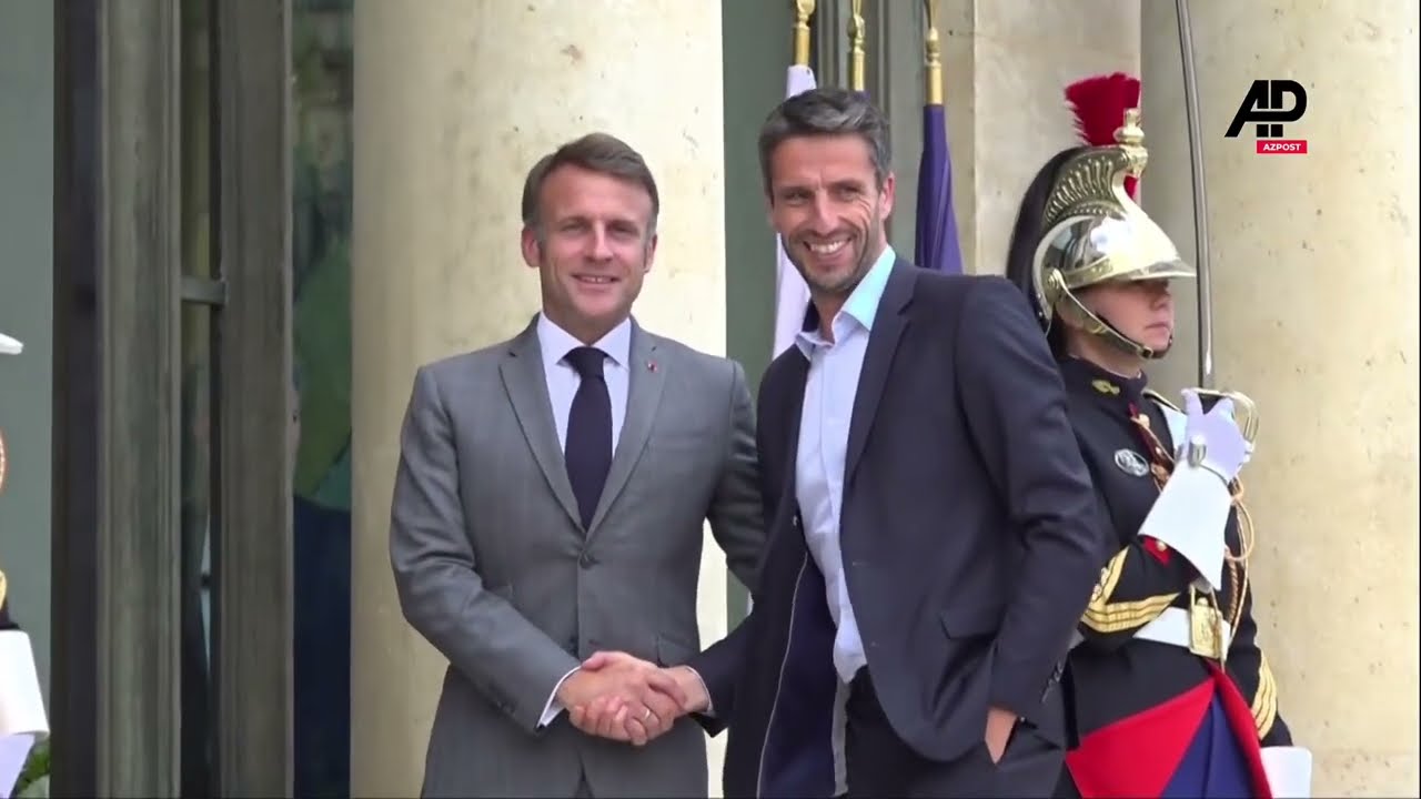 Emmanuel Macron, the French president, welcomes IOC president Thomas Bach and Tony Estanguet