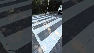 Reno Rd NW and Rodman St NW on 09/15/2026 at 08:47 AM – car stopped in crosswalk