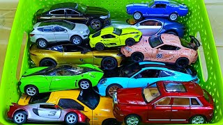 Box full of various miniature cars Jaguar, Peugeot, Renault, Hyundai, Mazda, Volvo, Honda, Opel #30