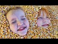 BURiED in CORN!!  Niko & Adley slide down Pumpkin Castle a family Halloween tradition and face paint