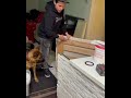 Guy slides the kitchen island over to reveal the entrance to a cool secret room below the kitchen.