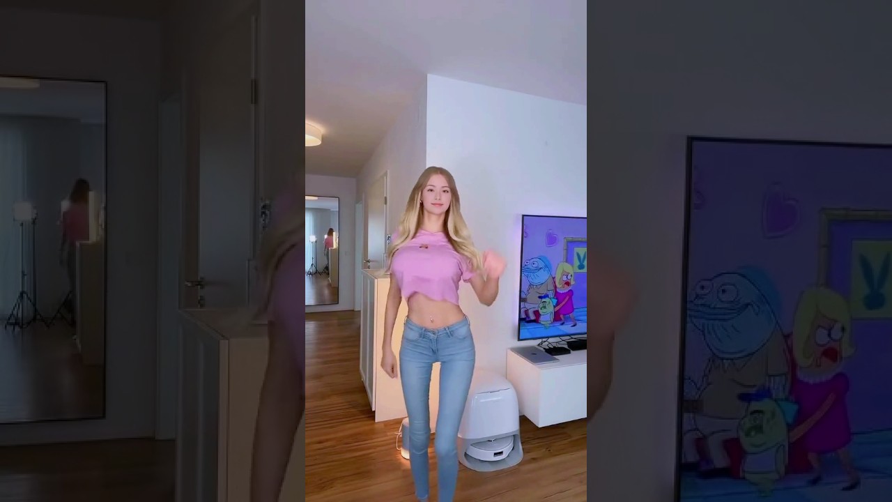 Beautiful Asian Girl in Belly-baring T-shirt and Jeans